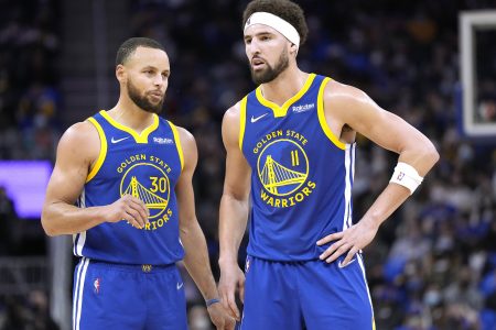 Klay Thompson (right) and Stephen Curry (left) of the Golden State Warriors talks with each other against Indiana Pacers during the first half of an NBA basketball game at Chase Center on January 20, 2022 in San Francisco, California.