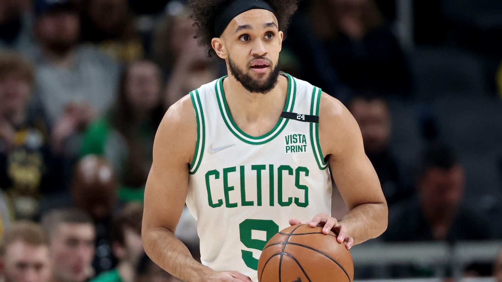 Derrick White #9 of the Boston Celtics dribbles the ball in the first quarter against the Indiana Pacers at Gainbridge Fieldhouse on February 27, 2022 in Indianapolis, Indiana.