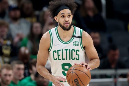 Derrick White #9 of the Boston Celtics dribbles the ball in the first quarter against the Indiana Pacers at Gainbridge Fieldhouse on February 27, 2022 in Indianapolis, Indiana.