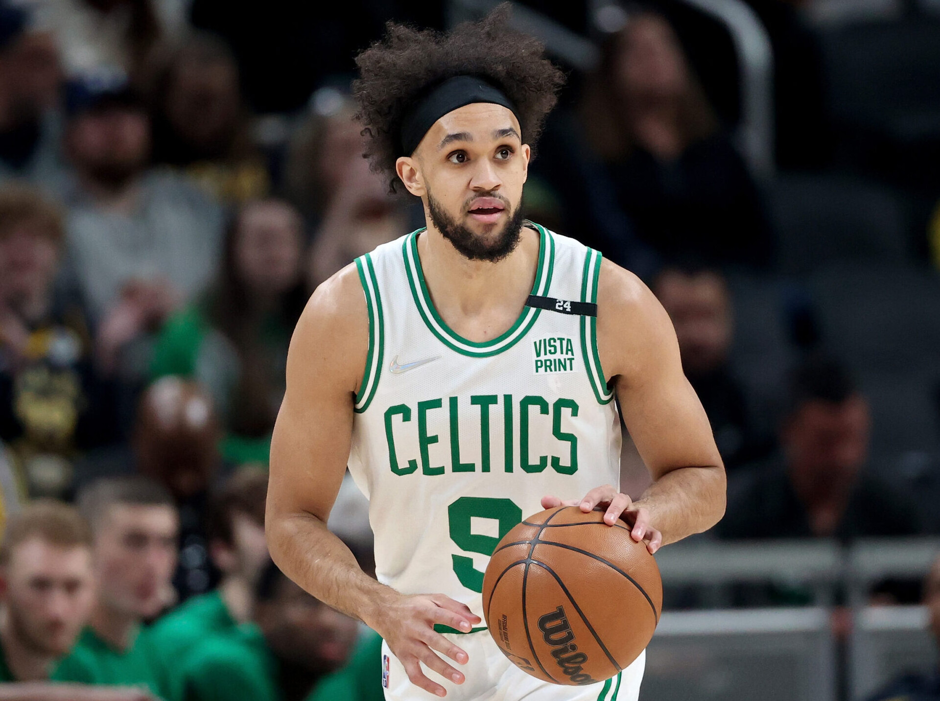 Derrick White #9 of the Boston Celtics dribbles the ball in the first quarter against the Indiana Pacers at Gainbridge Fieldhouse on February 27, 2022 in Indianapolis, Indiana.