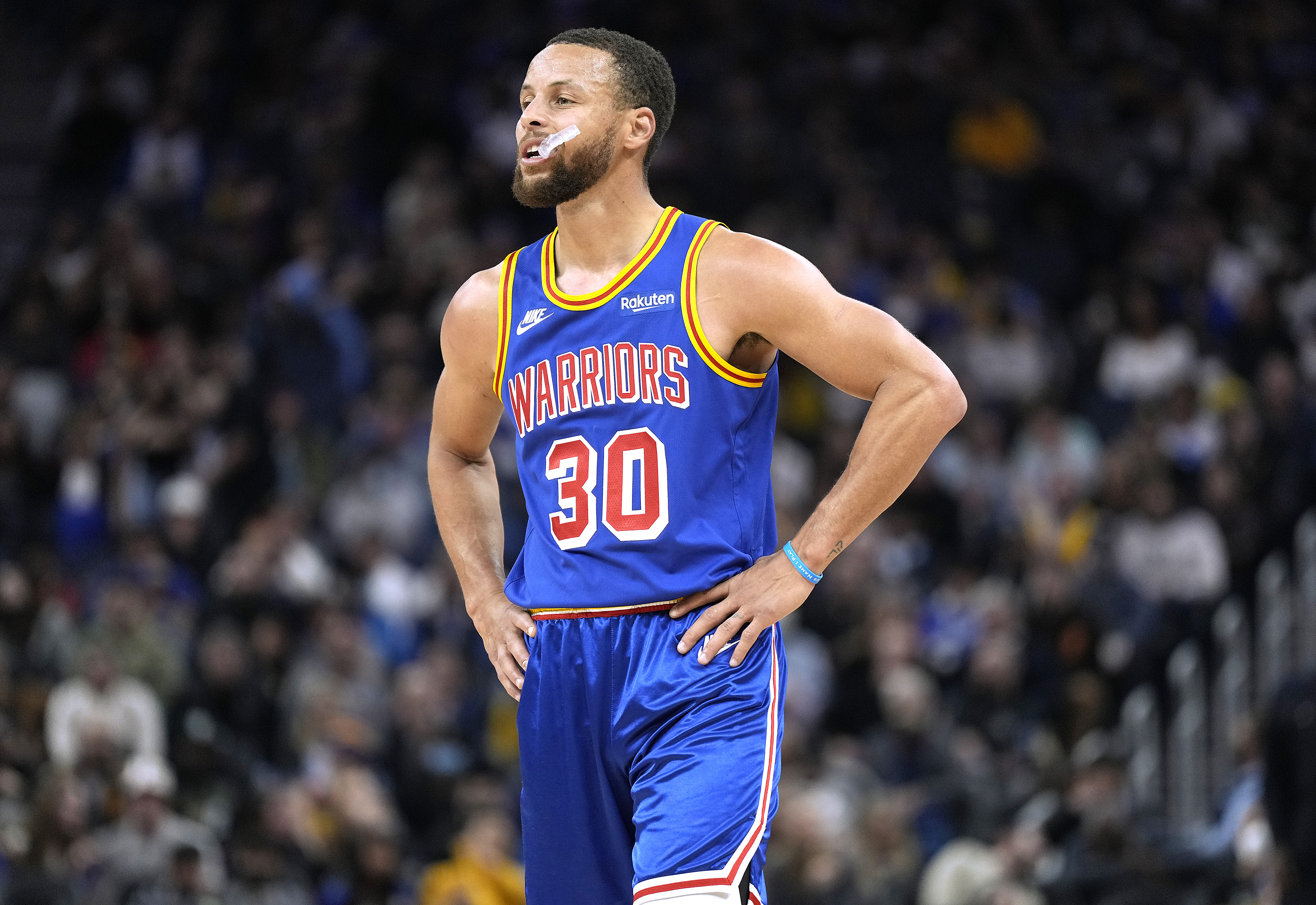 Stephen Curry #30 of the Golden State Warriors looks on against the Milwaukee Bucks in the second half of an NBA basketball game at Chase Center on March 12, 2022 in San Francisco, California.
