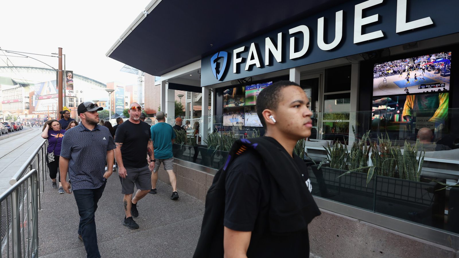Fans walk past a Fanduel sports betting location at Footprint Center before Game Five of the Western Conference First Round NBA Playoffs between the Phoenix Suns and the New Orleans Pelicans on April 26, 2022 in Phoenix, Arizona.