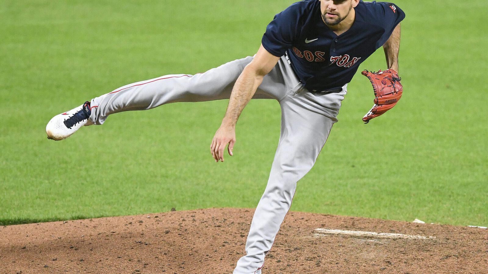 Boston Red Sox right-handed pitcher Nathan Eovaldi follows through with his right leg in the air after a delivery against the Baltimore Orioles on Saturday, April 30, 2022, in Baltimore.