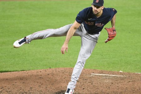 Boston Red Sox right-handed pitcher Nathan Eovaldi follows through with his right leg in the air after a delivery against the Baltimore Orioles on Saturday, April 30, 2022, in Baltimore.