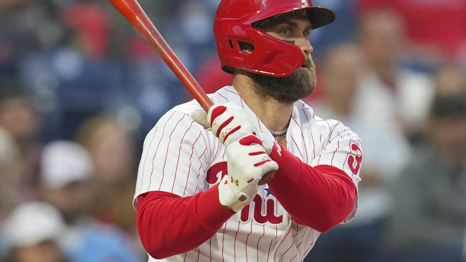 Philadelphia Phillies designated hitter Bryce Harper follows through on a swing against Texas on Wednesday, May 4, 2022, in Philadelphia.