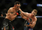 Justin Gaethje connects with an overhand right to the side of the face of Tony Ferguson (left) during UFC 249