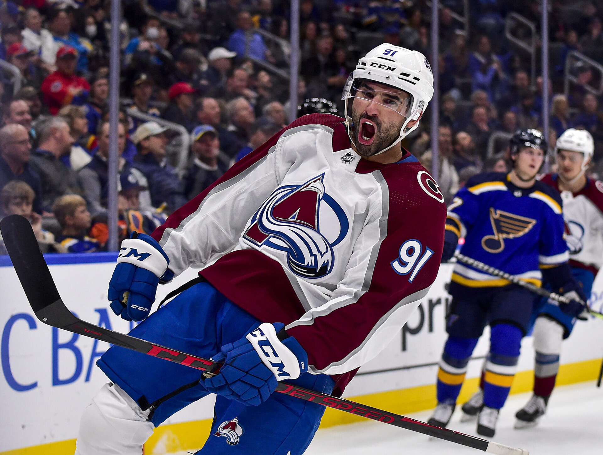 Colorado Avalanche center Nazem Kadri (foregrounds) reacts with a jubilant scream after scoring a goal against the St. Louis Blues