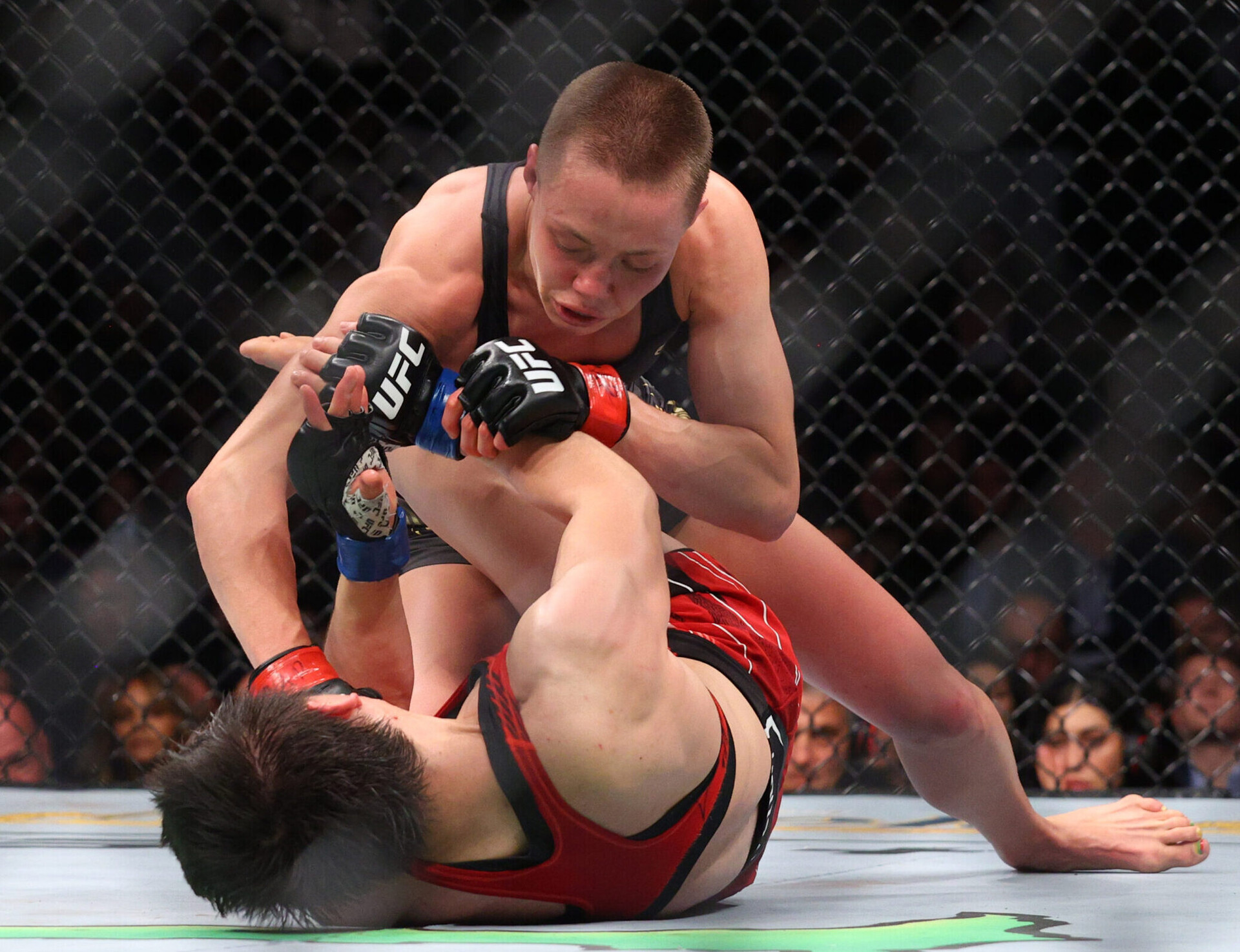 Rose Namajunas, top, competes against Zhang Weili, bottom, during UFC 268 at Madison Square Garden.