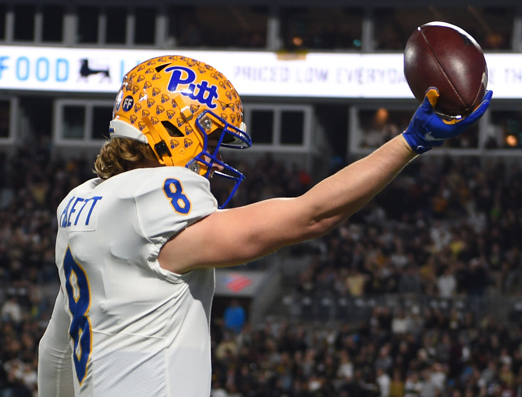 Pittsburgh Panthers quarterback Kenny Pickett holds out the ball after running for a touchdown in the first quarter of the ACC championship game at Bank of America Stadium on Dec. 4, 2021.