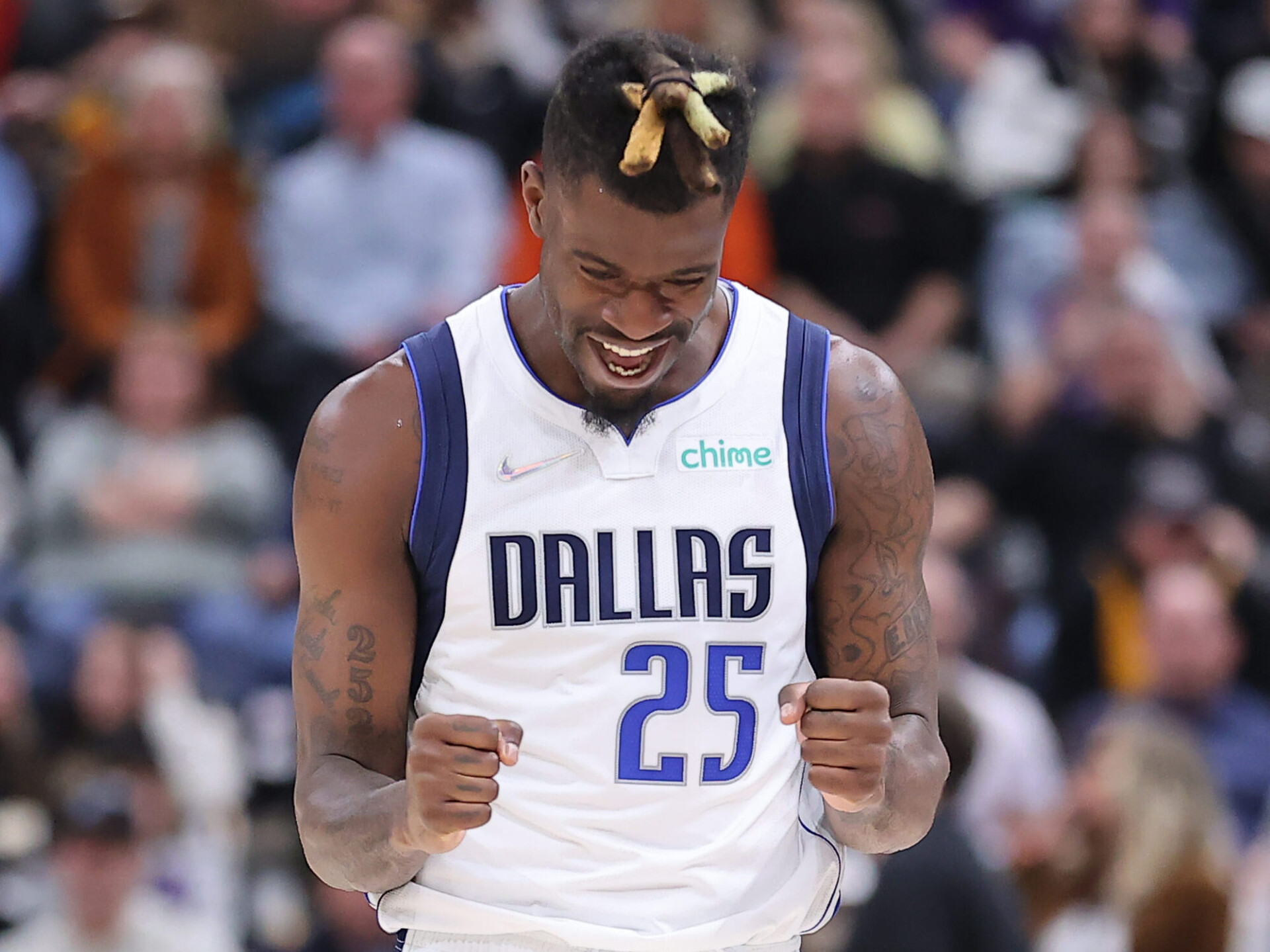 Dallas Mavericks forward Reggie Bullock pumps his clench fists as he celebrates making a play against the Utah Jazz