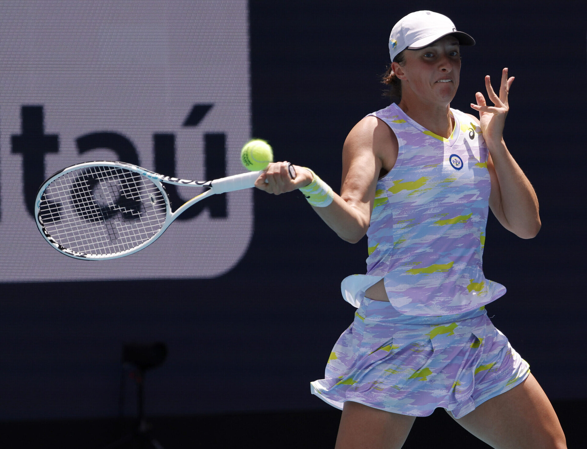 Iga Swiatek attacks the tennis ball with a forehand against Naomi Osaka (not pictured) in the women's singles final in the Miami Open