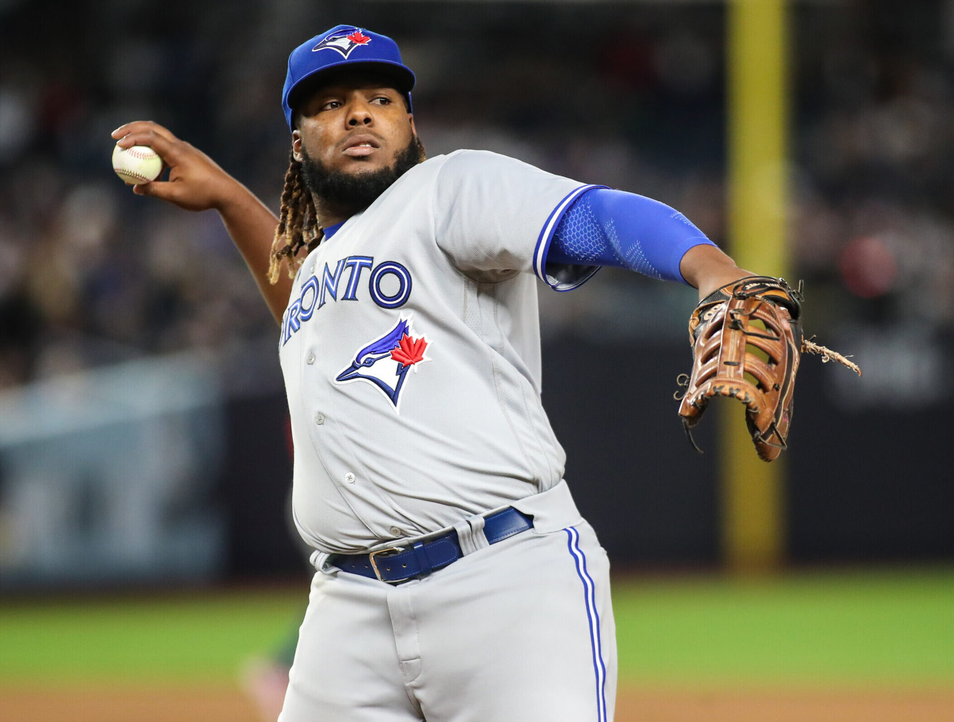 Toronto Blue Jays first baseman Vladimir Guerrero Jr. tosses a ball into the crowd during a break in a game against the Yankees in New York