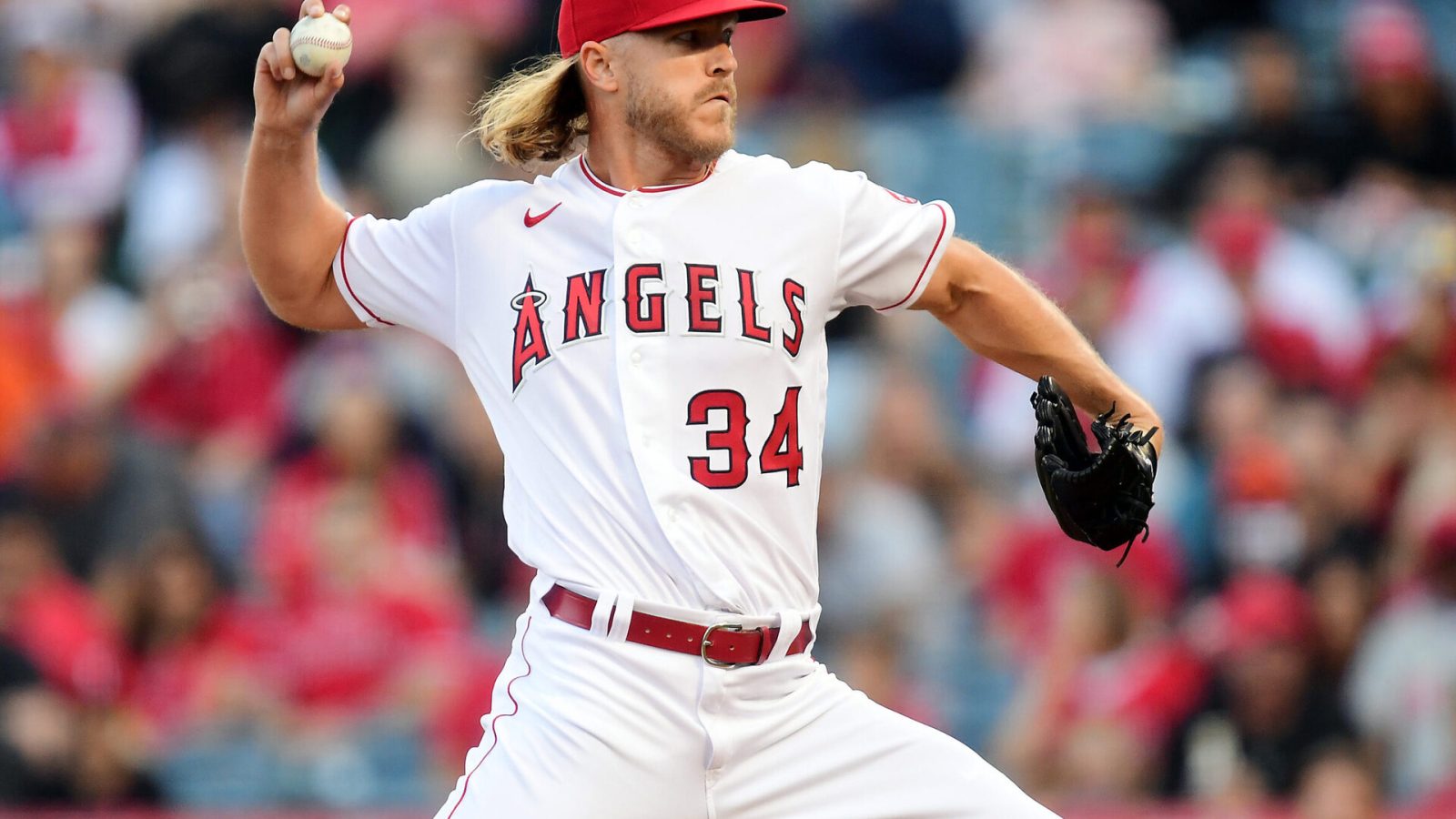Los Angeles Angels right-handed starting pitcher Noah Syndergaard grips the baseball with his right thumb and two fingers and prepares to deliver a pitch against the Baltimore Orioles