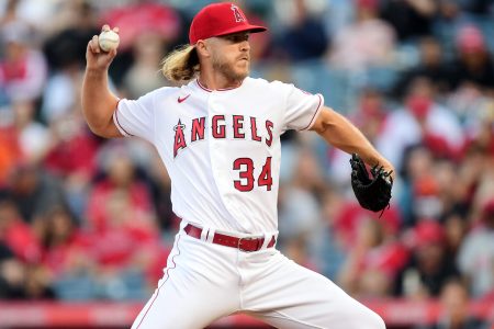 Los Angeles Angels right-handed starting pitcher Noah Syndergaard grips the baseball with his right thumb and two fingers and prepares to deliver a pitch against the Baltimore Orioles