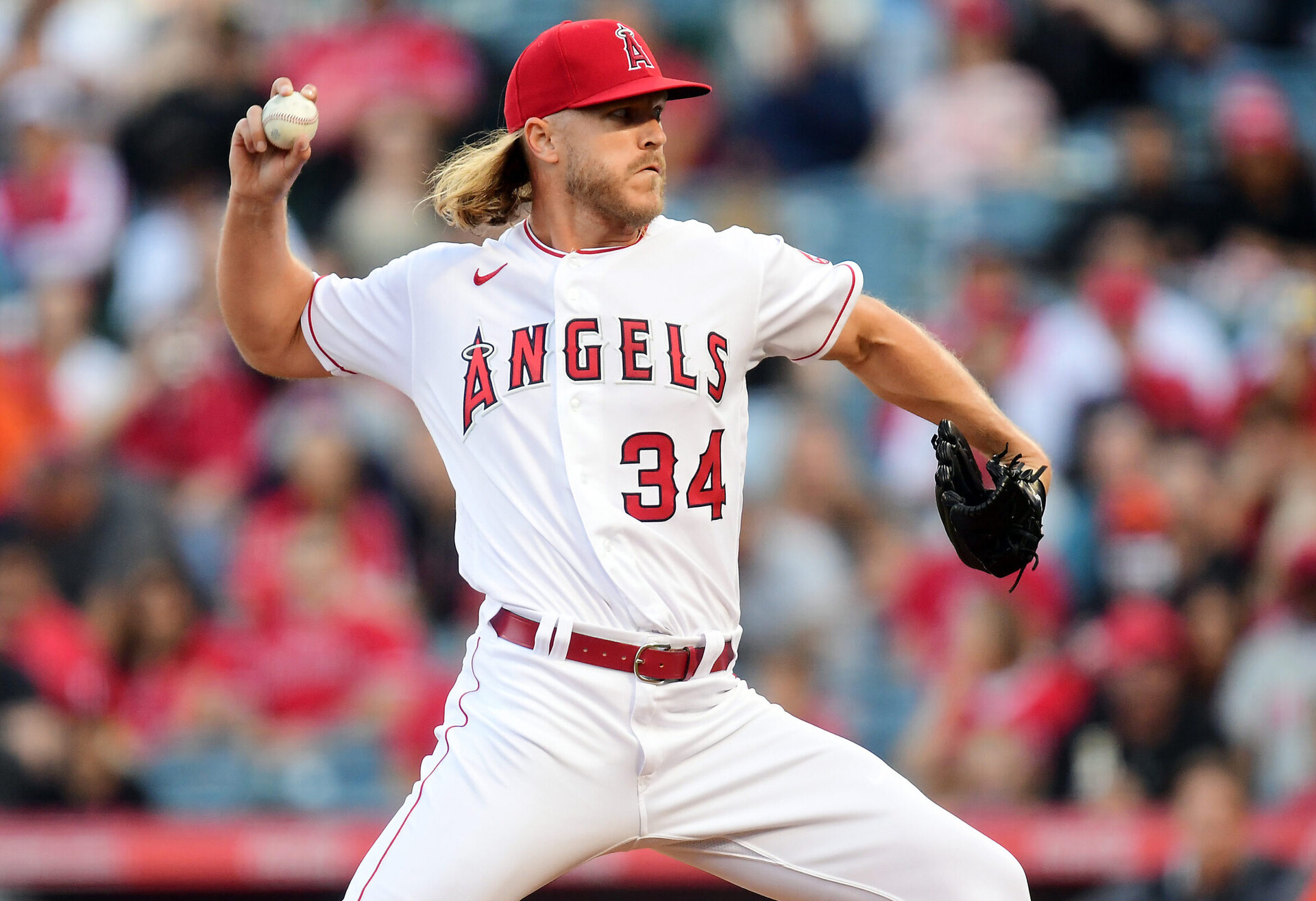 Los Angeles Angels right-handed starting pitcher Noah Syndergaard grips the baseball with his right thumb and two fingers and prepares to deliver a pitch against the Baltimore Orioles