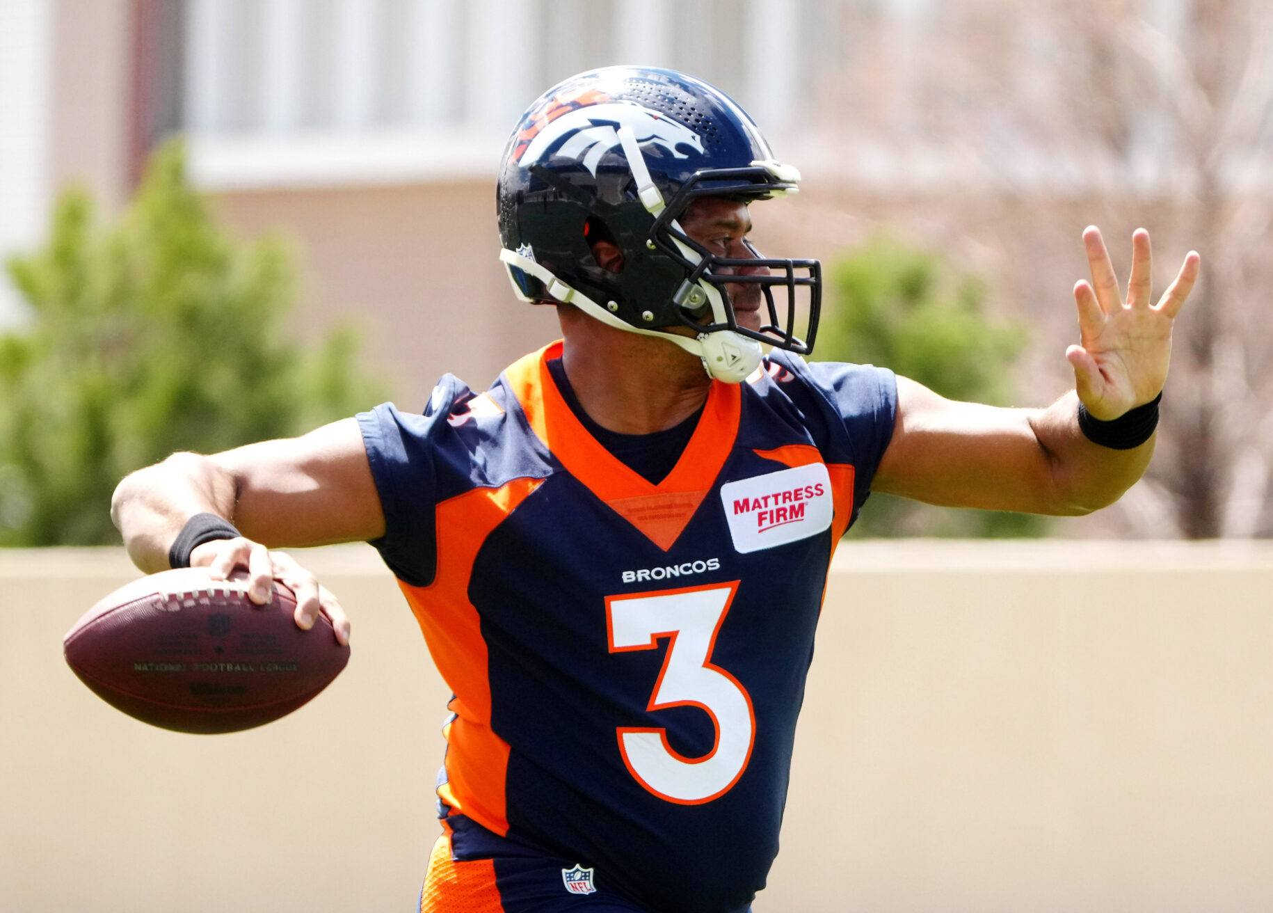 Denver Broncos quarterback Russell Wilson works out during a Denver Broncos mini camp at UCHealth Training Center.
