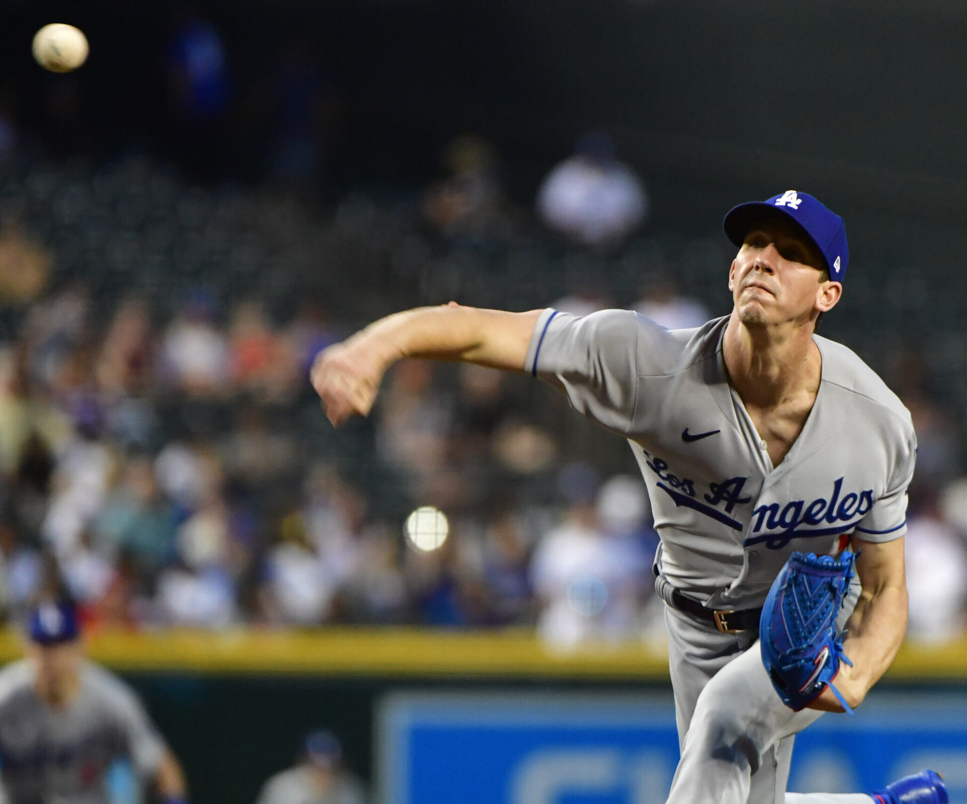 Los Angeles Dodgers right-handed starting pitcher Walker Buehler follows through after delivering a pitch against the Arizona Diamondbacks