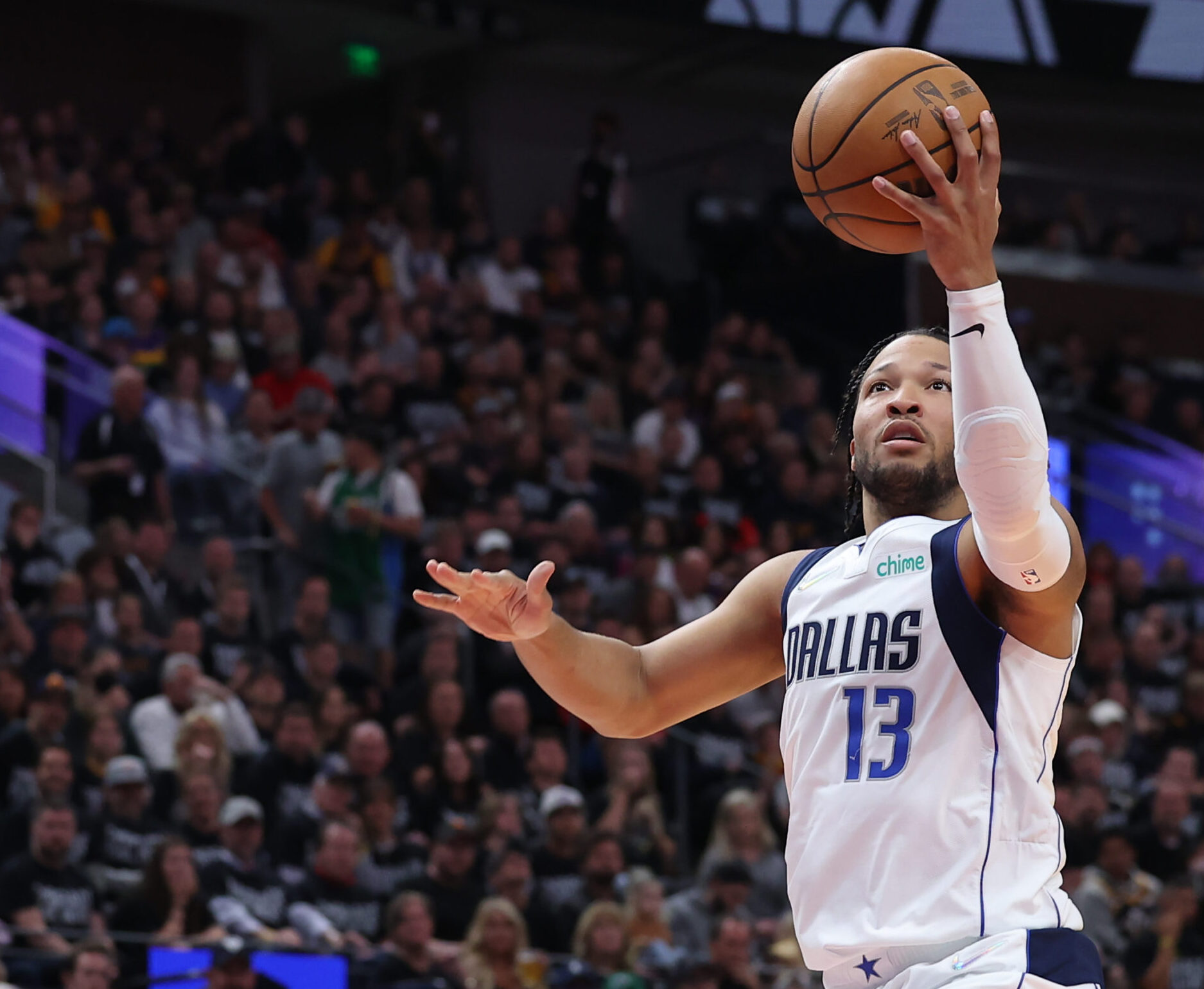 Dallas Mavericks guard Jalen Brunson lays the ball up with his left hand against the Utah Jazz
