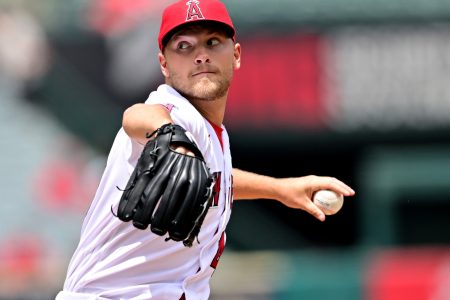 Los Angeles Angels left-handed starting pitcher Reid Detmers grips the baseball with his left hand and delivers a pitch iagainst the Cleveland Guardians