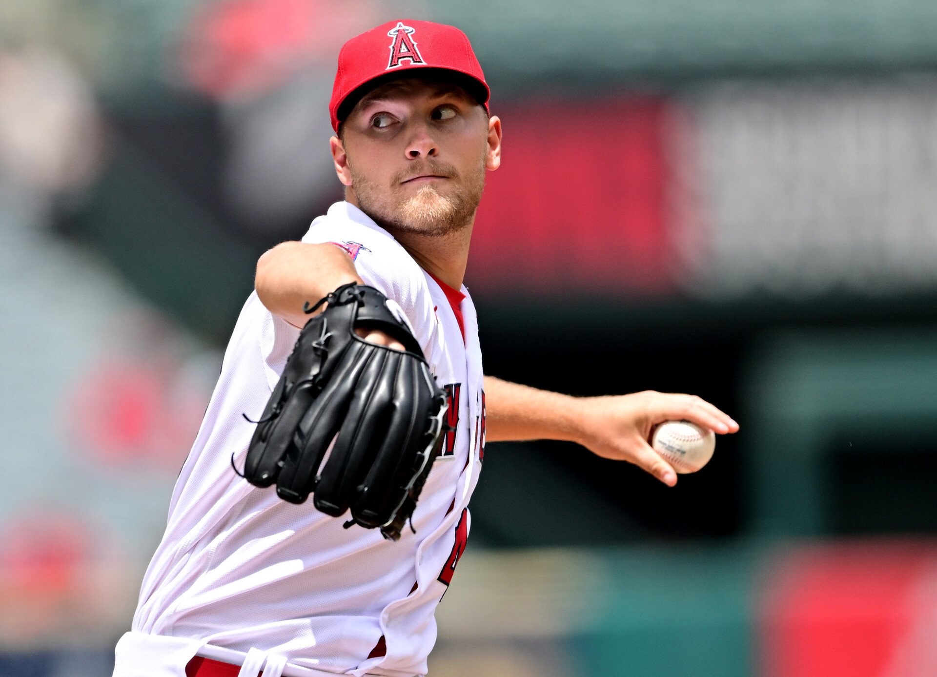 Los Angeles Angels left-handed starting pitcher Reid Detmers grips the baseball with his left hand and delivers a pitch iagainst the Cleveland Guardians