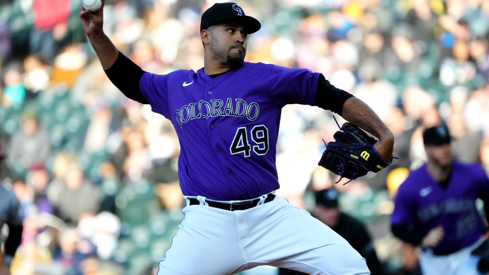 Colorado Rockies starting pitcher Antonio Senzatela (49) delivers a pitch in the first inning against the Cincinnati Reds at Coors Field.