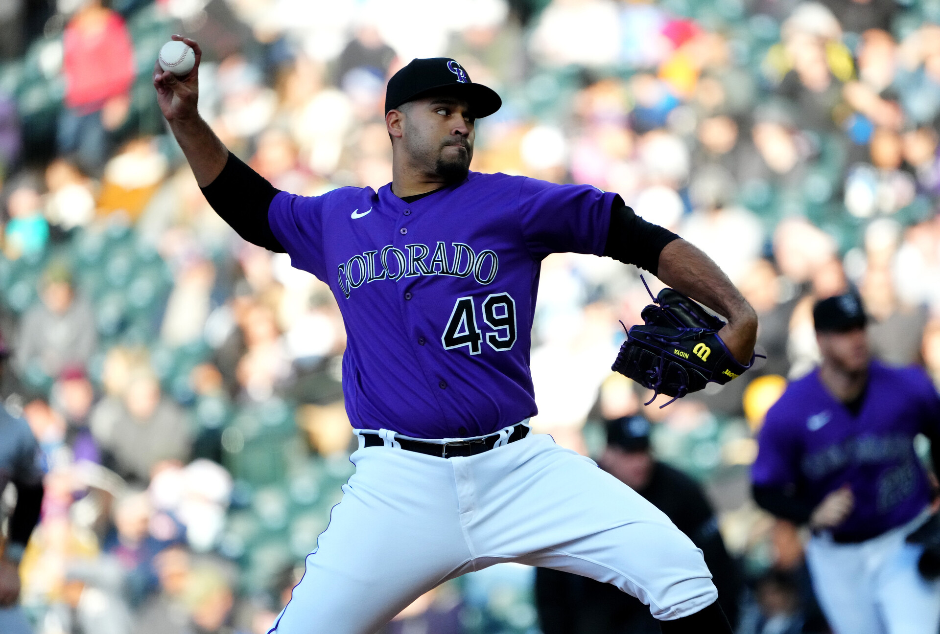 Colorado Rockies starting pitcher Antonio Senzatela (49) delivers a pitch in the first inning against the Cincinnati Reds at Coors Field.