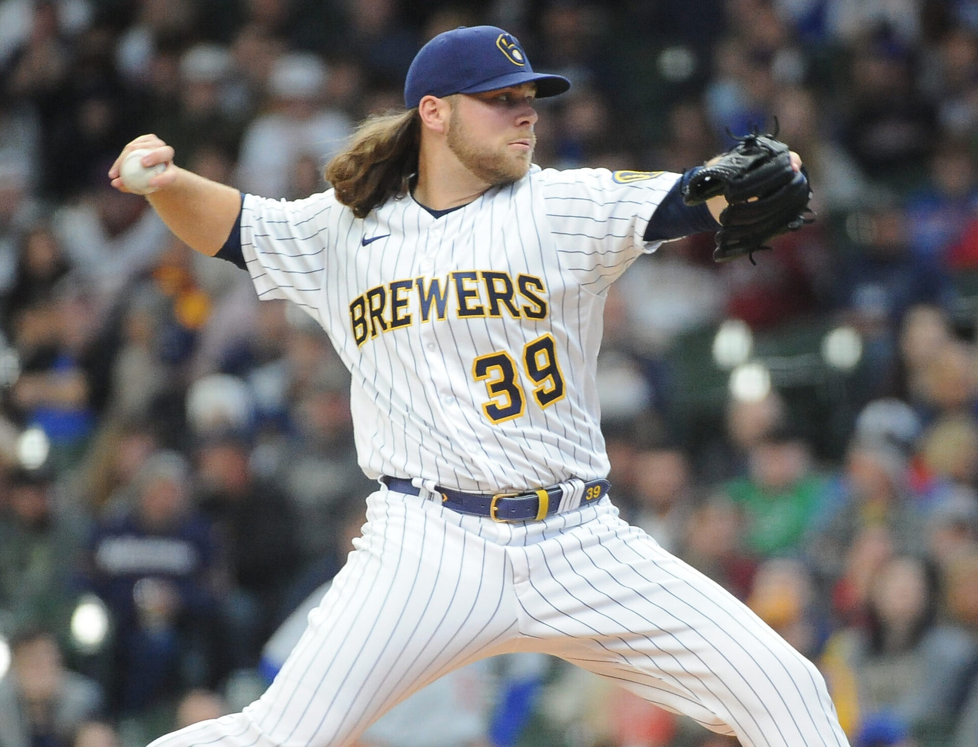 Milwaukee Brewers right-handed pitcher Corbin Burnes grips the baseball with his right hand and delivers a pitch against the Chicago Cubs