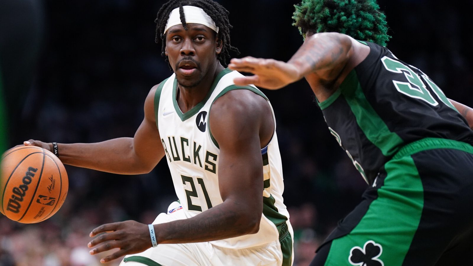 Milwaukee Bucks guard Jrue Holiday (21) drives the ball against Boston Celtics guard Marcus Smart (36) in the second half during game one of the second round for the 2022 NBA playoffs at TD Garden.