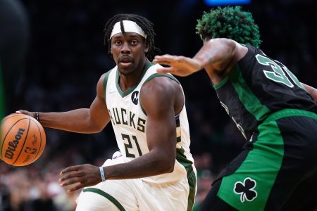 Milwaukee Bucks guard Jrue Holiday (21) drives the ball against Boston Celtics guard Marcus Smart (36) in the second half during game one of the second round for the 2022 NBA playoffs at TD Garden.