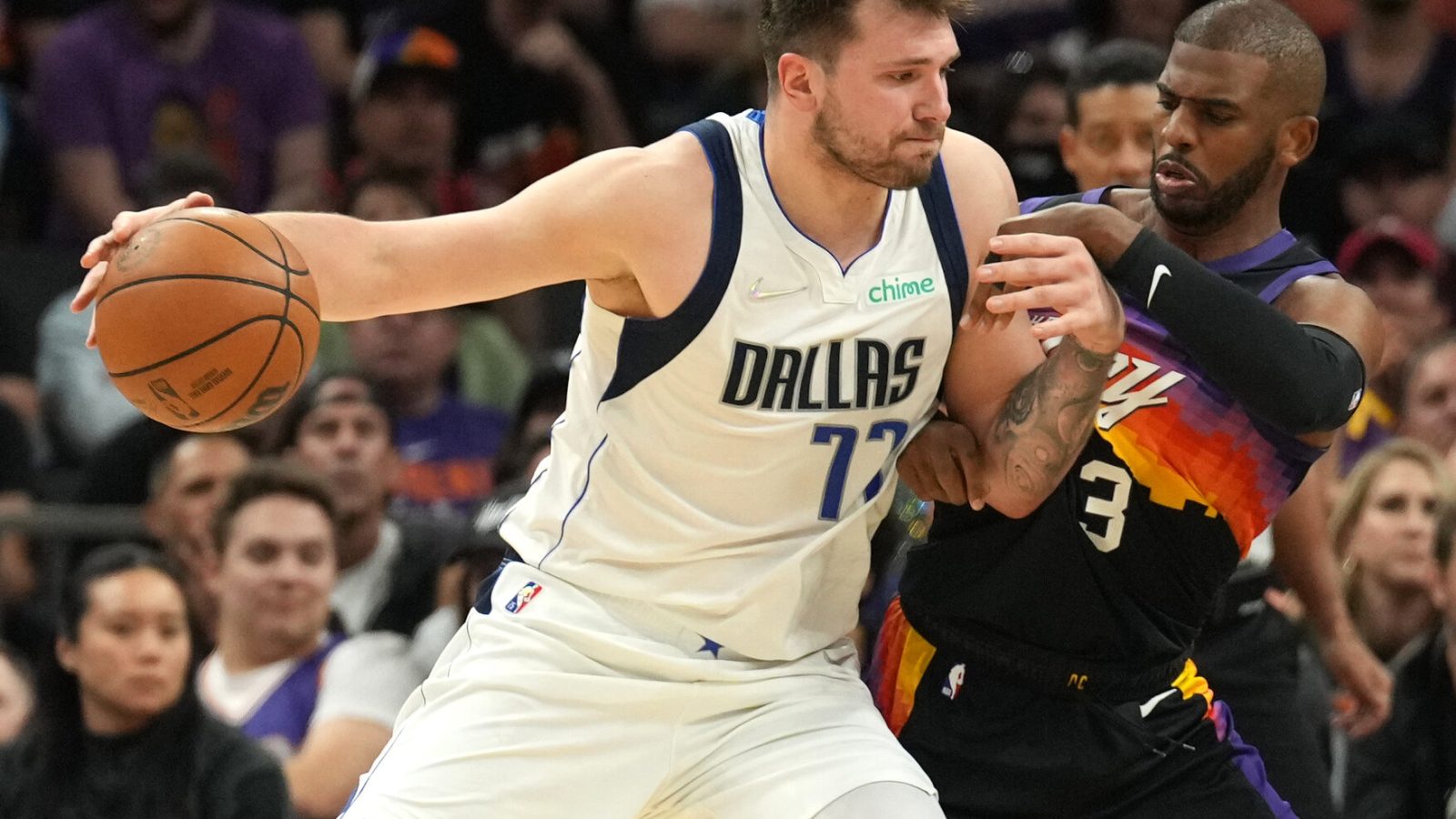 Phoenix Suns guard Chris Paul, right, guards Dallas Mavericks guard Luka Doncic, right, during the first half of game one of the second round for the 2022 NBA playoffs at Footprint Center on May 2, 2022.