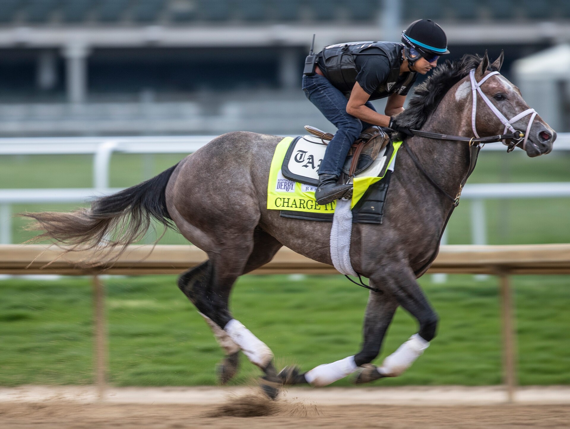 Kentucky Derby hopeful Charge It works out on the track at Churchill Downs. Jockey unidentified
