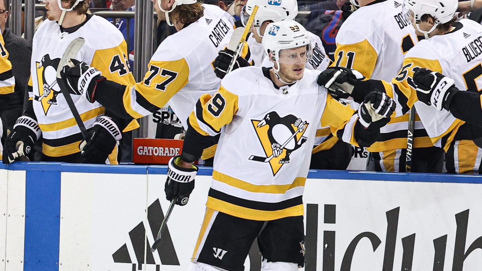 Pittsburgh Penguins left wing Jake Guentzel (center, on the ice) celebrates his goal with teammates against the New York Rangers