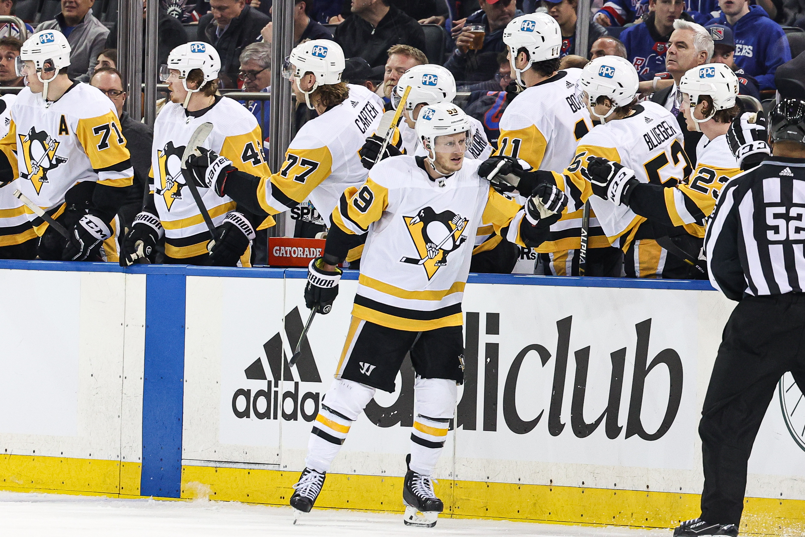 Pittsburgh Penguins left wing Jake Guentzel (center, on the ice) celebrates his goal with teammates against the New York Rangers