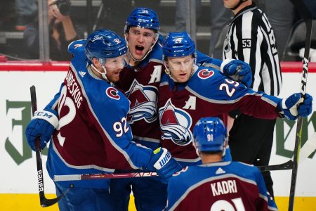 Colorado Avalanche center Nathan MacKinnon (29) celebrates his goal with left wing Gabriel Landeskog (92) and right wing Mikko Rantanen (96) during a Stanley Cup Playoff game against the Nashville Predators
