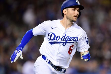 Los Angeles Dodgers shortstop Trea Turner sprints to first base and ends up on second after hitting a double against the San Francisco Giants