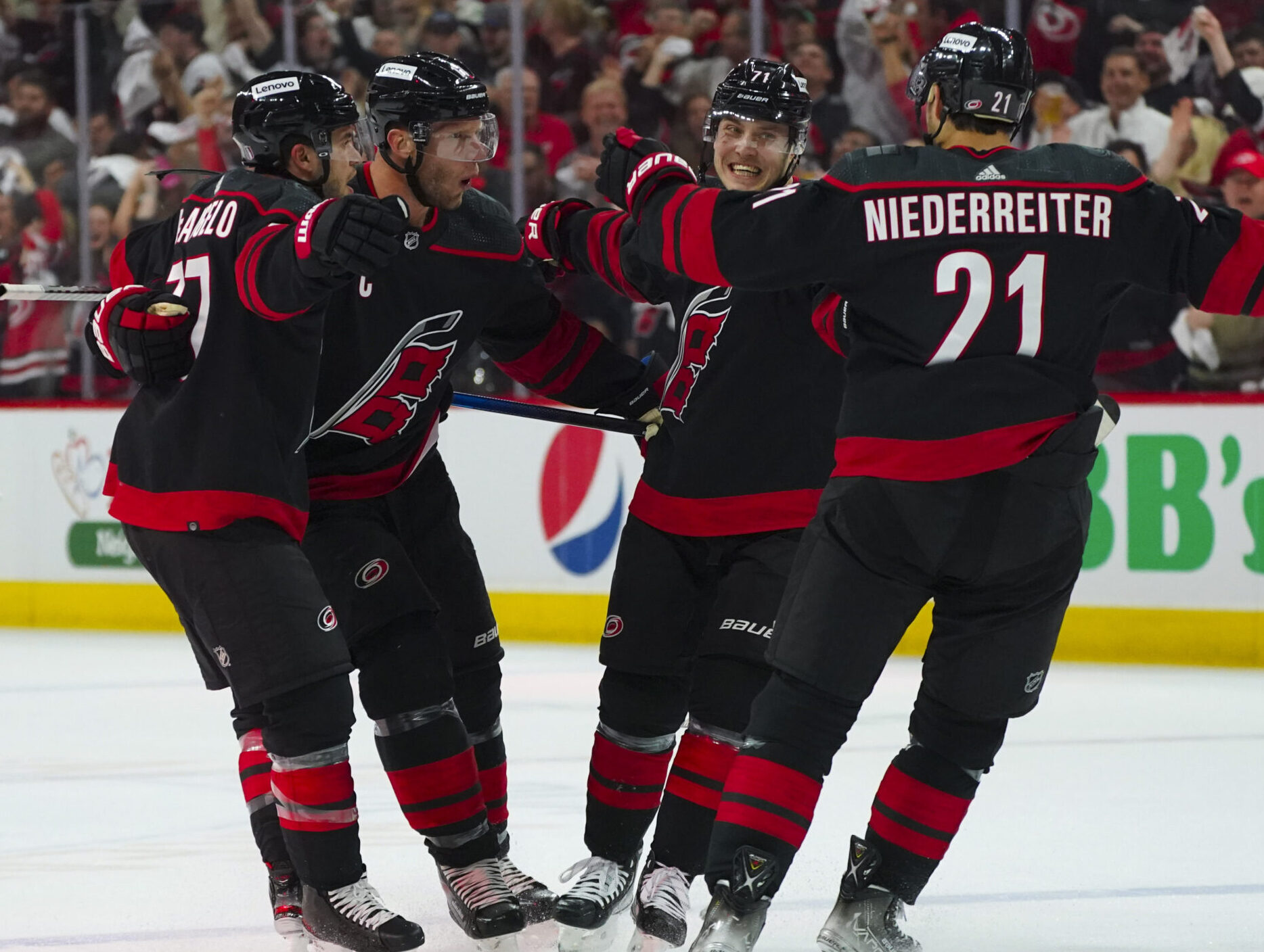 Carolina Hurricanes players Jesper Fast, Nino Niederreiter, Tony DeAngelo and center Jordan Staal after Fast's goal during Game 2 of the 2022 Stanley Cup Playoffs