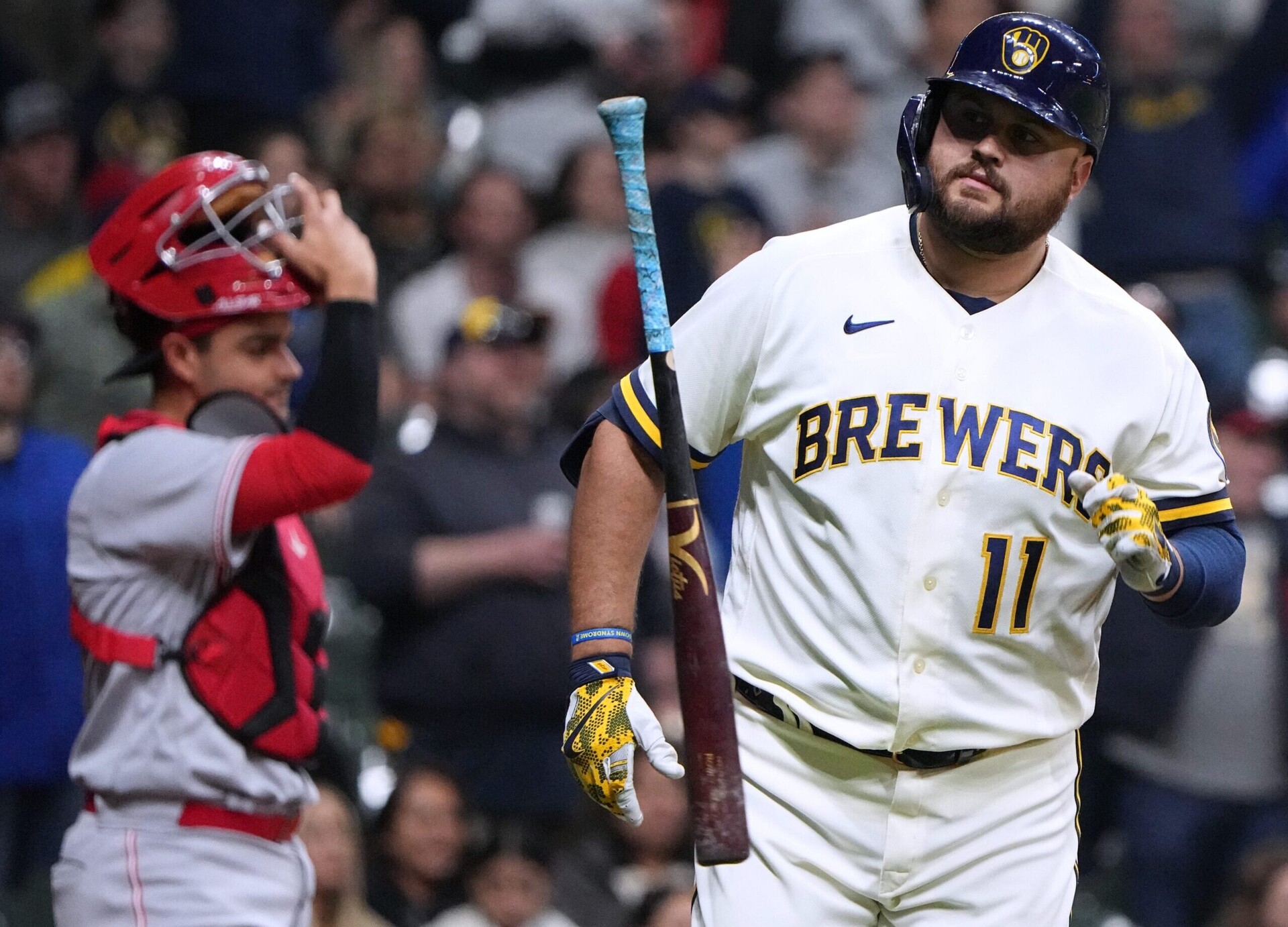 Milwaukee Brewers first baseman Rowdy Tellez flips his bat and trots to first base after hitting a two-run home against the Cincinnati Reds