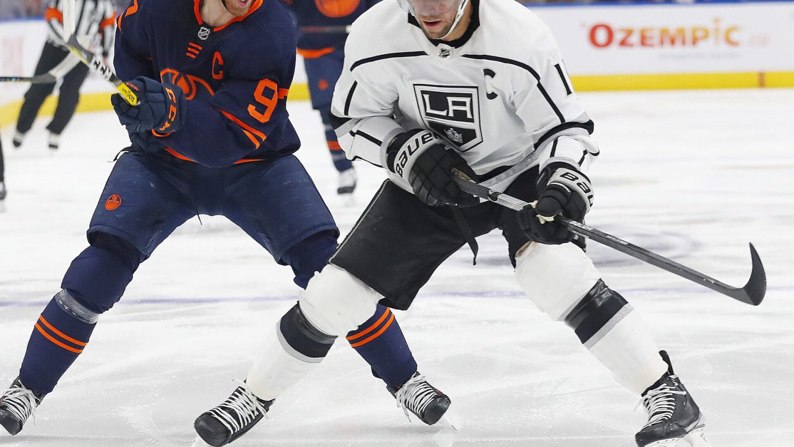 Edmonton Oilers forward Connor McDavid (left) and Los Angeles Kings forward Anze Kopitar (right) chase a loose puck during Game 2 of a Stanley Cup Playoff series