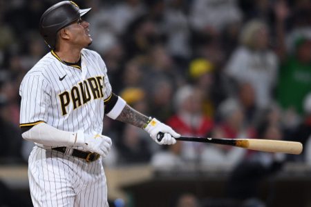 San Diego Padres third baseman Manny Machado holds his bat in his left hand and admires his home run against the Miami Marlins
