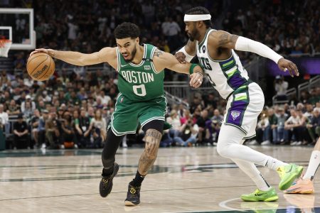 Boston Celtics forward Jayson Tatum (left) drives for the basket against Milwaukee Bucks guard Wesley Matthews (right) during the fourth quarter during game three of the second round for the 2022 NBA playoffs at Fiserv Forum.