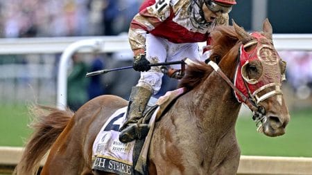 Sonny Leon aboard Rich Strike celebrates winning the 148th running of the Kentucky Derby at Churchill Downs on May 7, 2022.