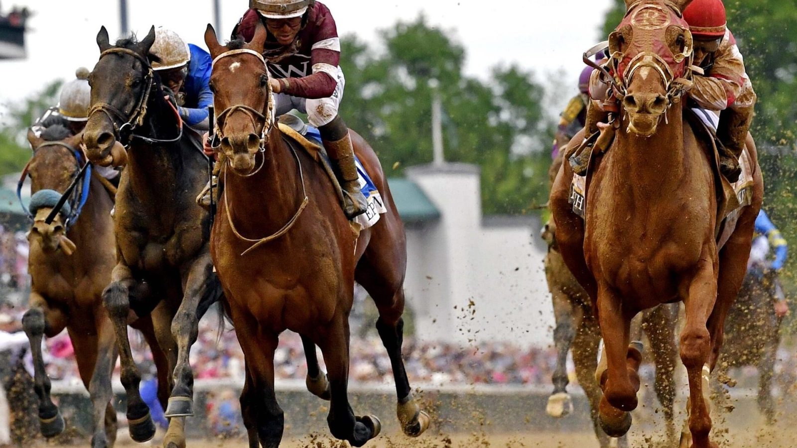 Sonny Leon aboard Rich Strike, right, wins the 148th running of the Kentucky Derby at Churchill Downs on May 7, 2022.