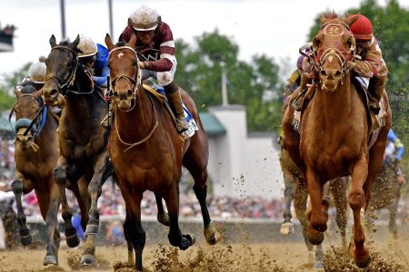 Sonny Leon aboard Rich Strike, right, wins the 148th running of the Kentucky Derby at Churchill Downs on May 7, 2022.