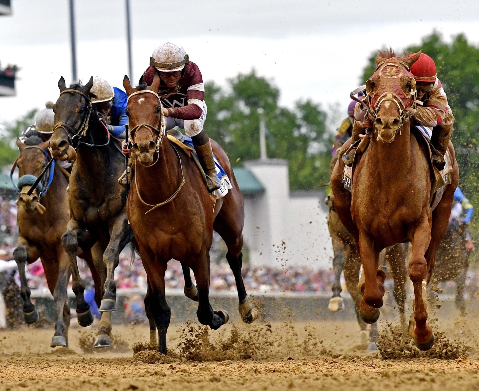 Sonny Leon aboard Rich Strike, right, wins the 148th running of the Kentucky Derby at Churchill Downs on May 7, 2022.