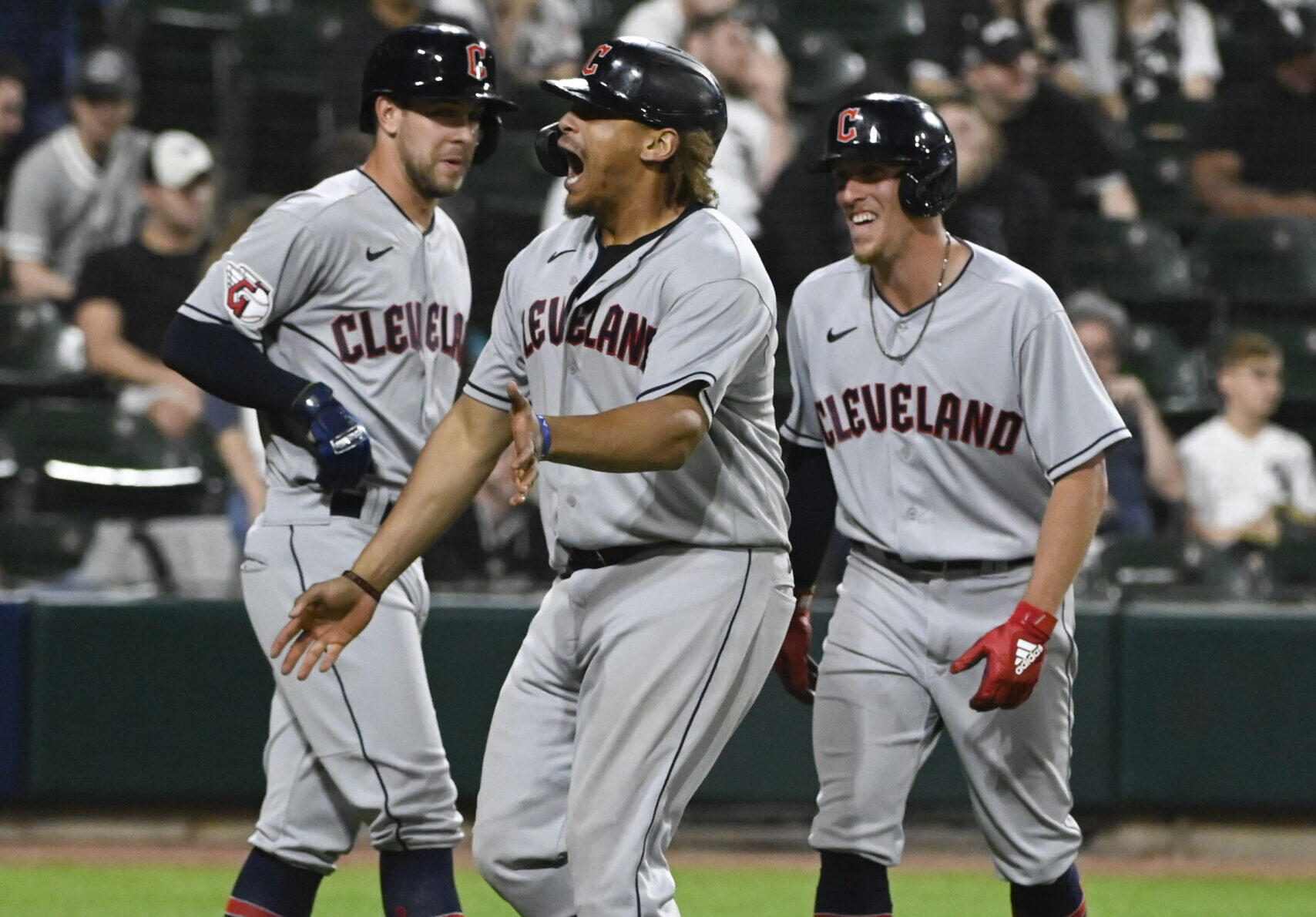 Cleveland Guardians first baseman Josh Naylor (center) celebrates with teammates after hitting a three-run home run in the 11th inning against the Chicago White Sox