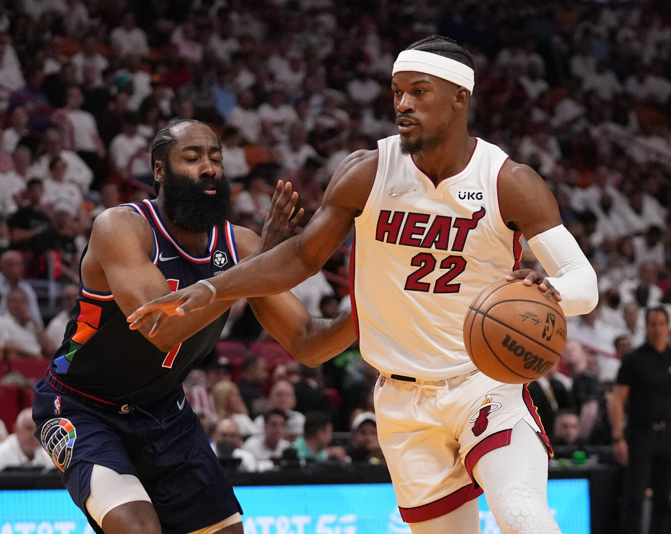 Miami Heat forward Jimmy Butler, right, drives the ball around Philadelphia 76ers guard James Harden, left, during the second half in game five of the second round for the 2022 NBA playoffs at FTX Arena on May 10, 2022.