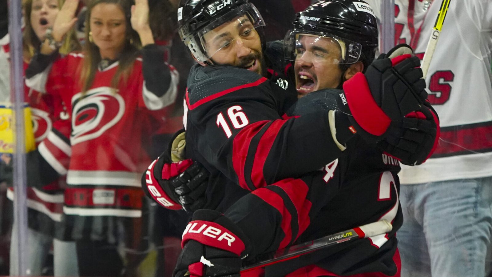 Carolina Hurricanes center Seth Jarvis (right) celebrates his goal with teammate Vincent Trocheck (left) against the Boston Bruins during a 2022 Stanley Cup Playoffs game