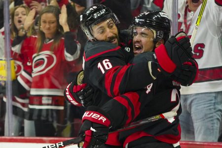 Carolina Hurricanes center Seth Jarvis (right) celebrates his goal with teammate Vincent Trocheck (left) against the Boston Bruins during a 2022 Stanley Cup Playoffs game