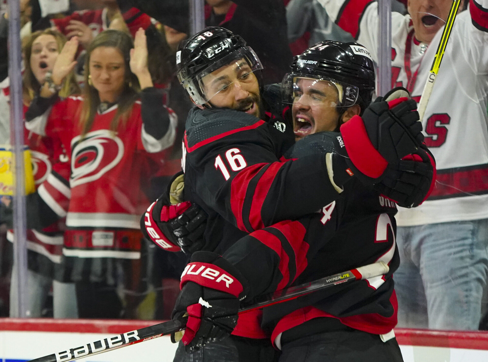 Carolina Hurricanes center Seth Jarvis (right) celebrates his goal with teammate Vincent Trocheck (left) against the Boston Bruins during a 2022 Stanley Cup Playoffs game