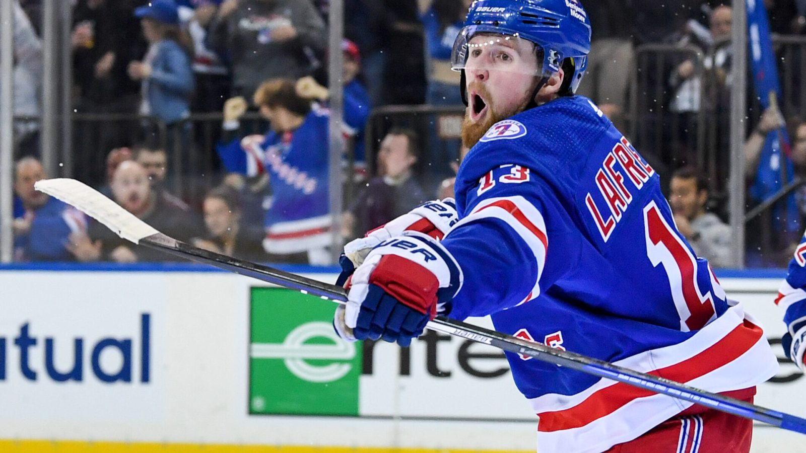 New York Rangers left wing Alexis Lafreniere shouts as he celebrates his goal against the Pittsburgh Penguins during a 2022 Stanley Cup Playoffs game